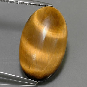 Натуральный коричневый tiger's eye 11,94 карата огранка овал, непрозрачный
