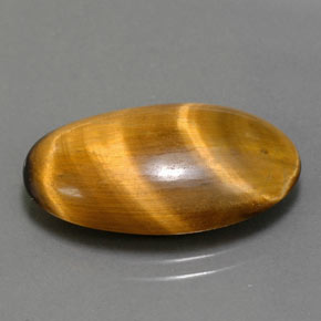 Натуральный коричневый tiger's eye 11,94 карата огранка овал, непрозрачный