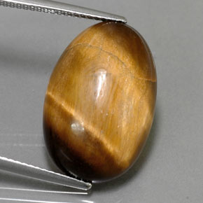 Натуральный коричневый tiger's eye 13,32 карата огранка овал, непрозрачный