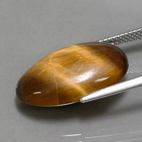 Натуральный коричневый tiger's eye 13,32 карата огранка овал, непрозрачный