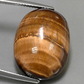 Натуральный коричневый tiger's eye 24,80 карата огранка овал, непрозрачный