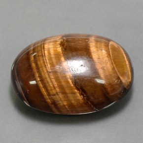 Натуральный коричневый tiger's eye 24,80 карата огранка овал, непрозрачный