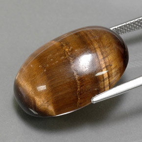 Натуральный коричневый tiger's eye 24,80 карата огранка овал, непрозрачный