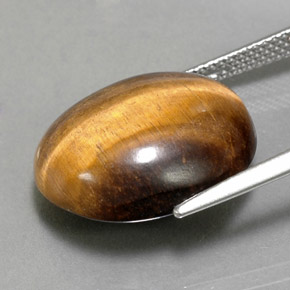 Натуральный коричневый tiger's eye 14,18 карата огранка овал, непрозрачный