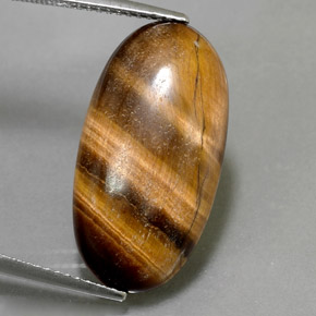 Натуральный коричневый tiger's eye 11,79 карата огранка овал, непрозрачный