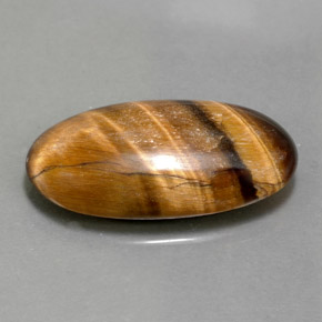 Натуральный коричневый tiger's eye 11,79 карата огранка овал, непрозрачный