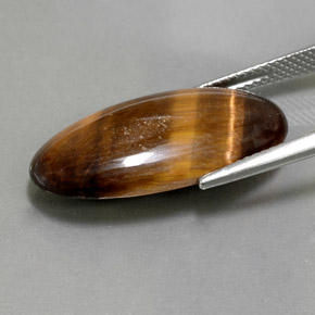 Натуральный коричневый tiger's eye 13,84 карата огранка овал, непрозрачный