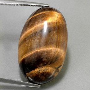 Натуральный коричневый tiger's eye 26,13 карата огранка овал, непрозрачный
