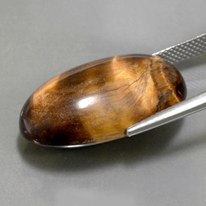 Натуральный коричневый tiger's eye 26,13 карата огранка овал, непрозрачный