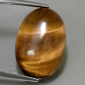 Натуральный коричневый tiger's eye 11,07 карата огранка овал, непрозрачный