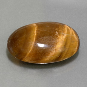 Натуральный коричневый tiger's eye 11,07 карата огранка овал, непрозрачный
