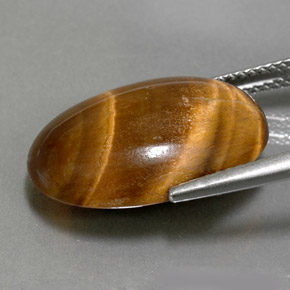 Натуральный коричневый tiger's eye 11,07 карата огранка овал, непрозрачный