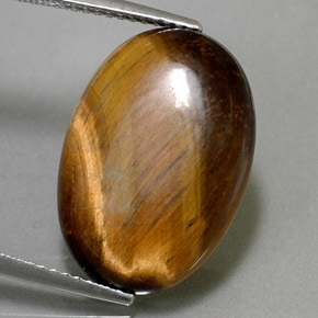 Натуральный коричневый tiger's eye 10,40 карата огранка овал, непрозрачный