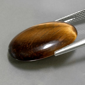 Натуральный коричневый tiger's eye 10,40 карата огранка овал, непрозрачный