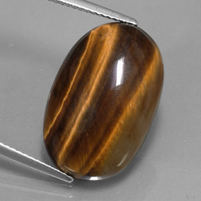 Натуральный коричневый tiger's eye 14,42 карата огранка овал, непрозрачный
