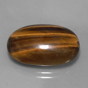 Натуральный коричневый tiger's eye 14,42 карата огранка овал, непрозрачный