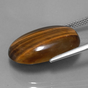 Натуральный коричневый tiger's eye 14,42 карата огранка овал, непрозрачный