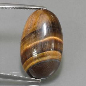 Натуральный коричневый tiger's eye 13,07 карата огранка овал, непрозрачный