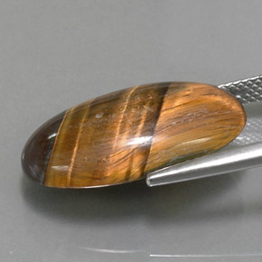 Натуральный коричневый tiger's eye 13,07 карата огранка овал, непрозрачный