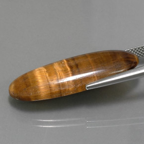Натуральный коричневый tiger's eye 18,16 карата огранка овал, непрозрачный