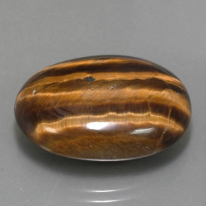 Натуральный коричневый tiger's eye 25,04 карата огранка овал, непрозрачный