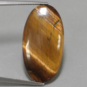 Натуральный коричневый tiger's eye 14,24 карата огранка овал, непрозрачный