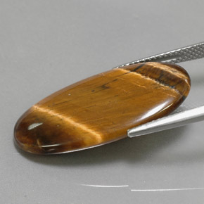 Натуральный коричневый tiger's eye 14,24 карата огранка овал, непрозрачный