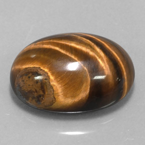 Натуральный коричневый tiger's eye 15,36 карата огранка овал, непрозрачный