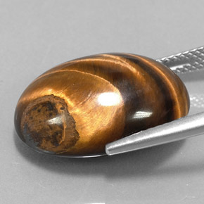 Натуральный коричневый tiger's eye 15,36 карата огранка овал, непрозрачный