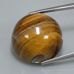 Натуральный коричневый tiger's eye 36,26 карата огранка круг, непрозрачный