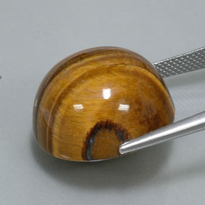 Натуральный коричневый tiger's eye 36,26 карата огранка круг, непрозрачный