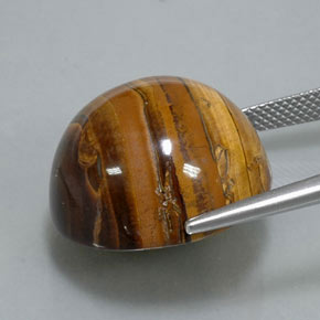 Натуральный коричневый tiger's eye 38,37 карата огранка круг, непрозрачный
