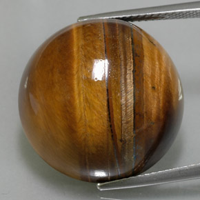 Натуральный коричневый tiger's eye 36,05 карата огранка круг, непрозрачный
