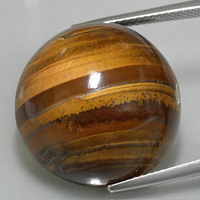 Натуральный коричневый tiger's eye 35,88 карата огранка круг, непрозрачный