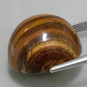 Натуральный коричневый tiger's eye 35,88 карата огранка круг, непрозрачный