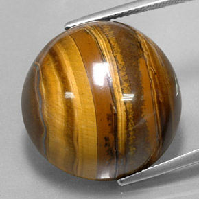 Натуральный коричневый tiger's eye 37,72 карата огранка круг, непрозрачный