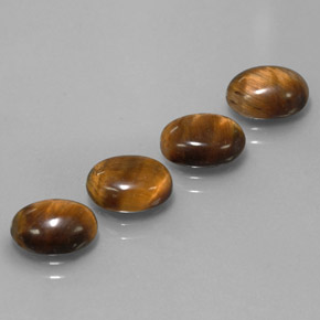 Натуральный коричневый tiger's eye  карата огранка овал, непрозрачный