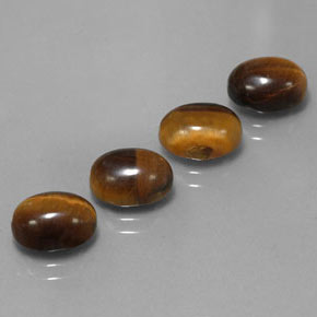 Натуральный коричневый tiger's eye  карата огранка овал, непрозрачный