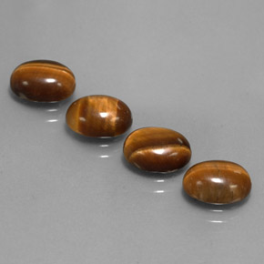 Натуральный коричневый tiger's eye  карата огранка овал, непрозрачный