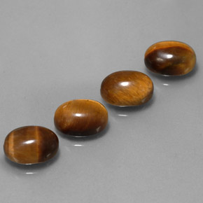 Натуральный коричневый tiger's eye  карата огранка овал, непрозрачный