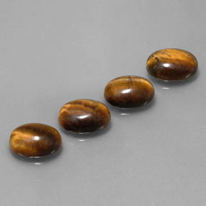 Натуральный коричневый tiger's eye  карата огранка овал, непрозрачный