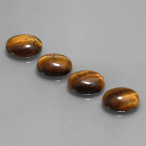 Натуральный коричневый tiger's eye  карата огранка овал, непрозрачный
