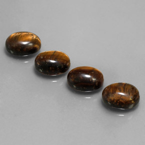 Натуральный коричневый tiger's eye  карата огранка овал, непрозрачный