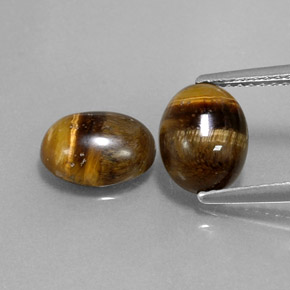 Натуральный коричневый tiger's eye  карата огранка овал, непрозрачный