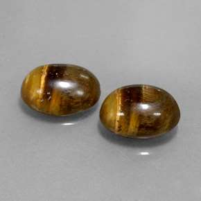 Натуральный коричневый tiger's eye  карата огранка овал, непрозрачный