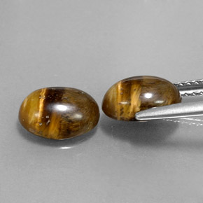 Натуральный коричневый tiger's eye  карата огранка овал, непрозрачный