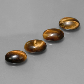 Натуральный коричневый tiger's eye  карата огранка овал, непрозрачный