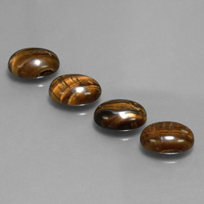 Натуральный коричневый tiger's eye  карата огранка овал, непрозрачный
