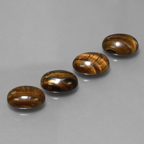 Натуральный коричневый tiger's eye  карата огранка овал, непрозрачный