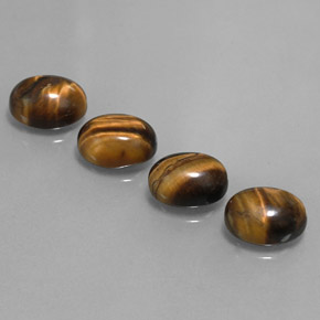 Натуральный коричневый tiger's eye 8,36 карата огранка овал, непрозрачный